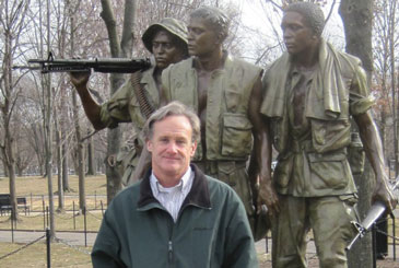 Al Estes in front of Statue