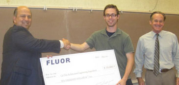 Mike Milazzo presents a check from Flour