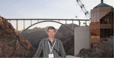 Peter Laursen stands in  front of bridge