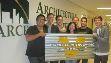 Students Hold Verco Decking Sign