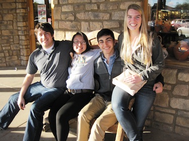 Students hamming it up on a bench at leadership conference