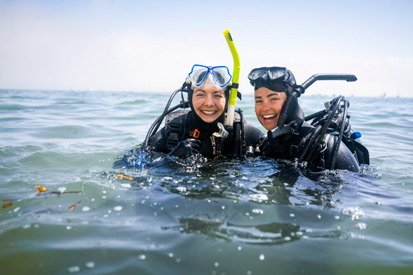 Two Cal Poly students pause during a marine sciences diving course. 