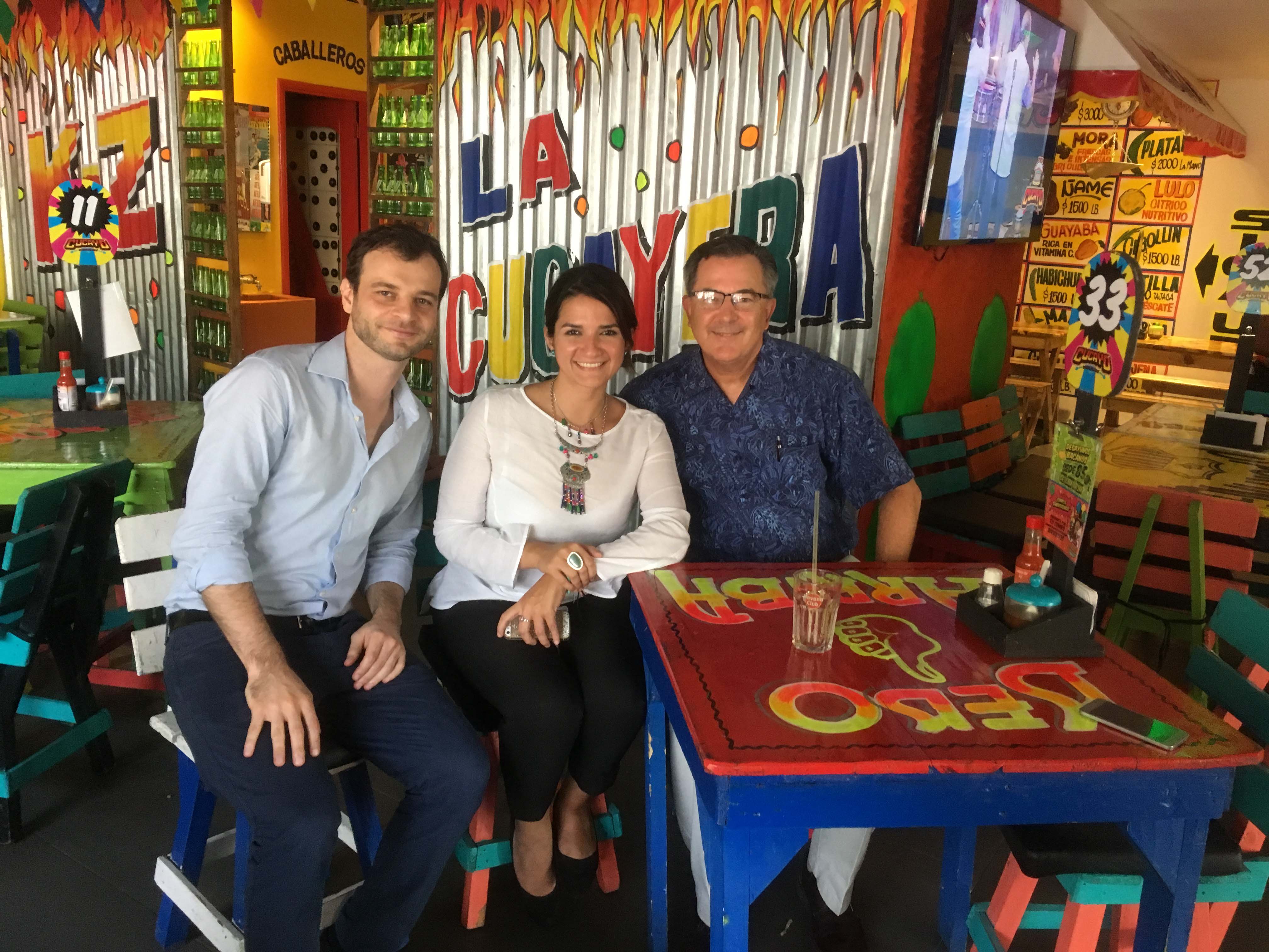 Williams with two of his former students in Barranquilla, Colombia