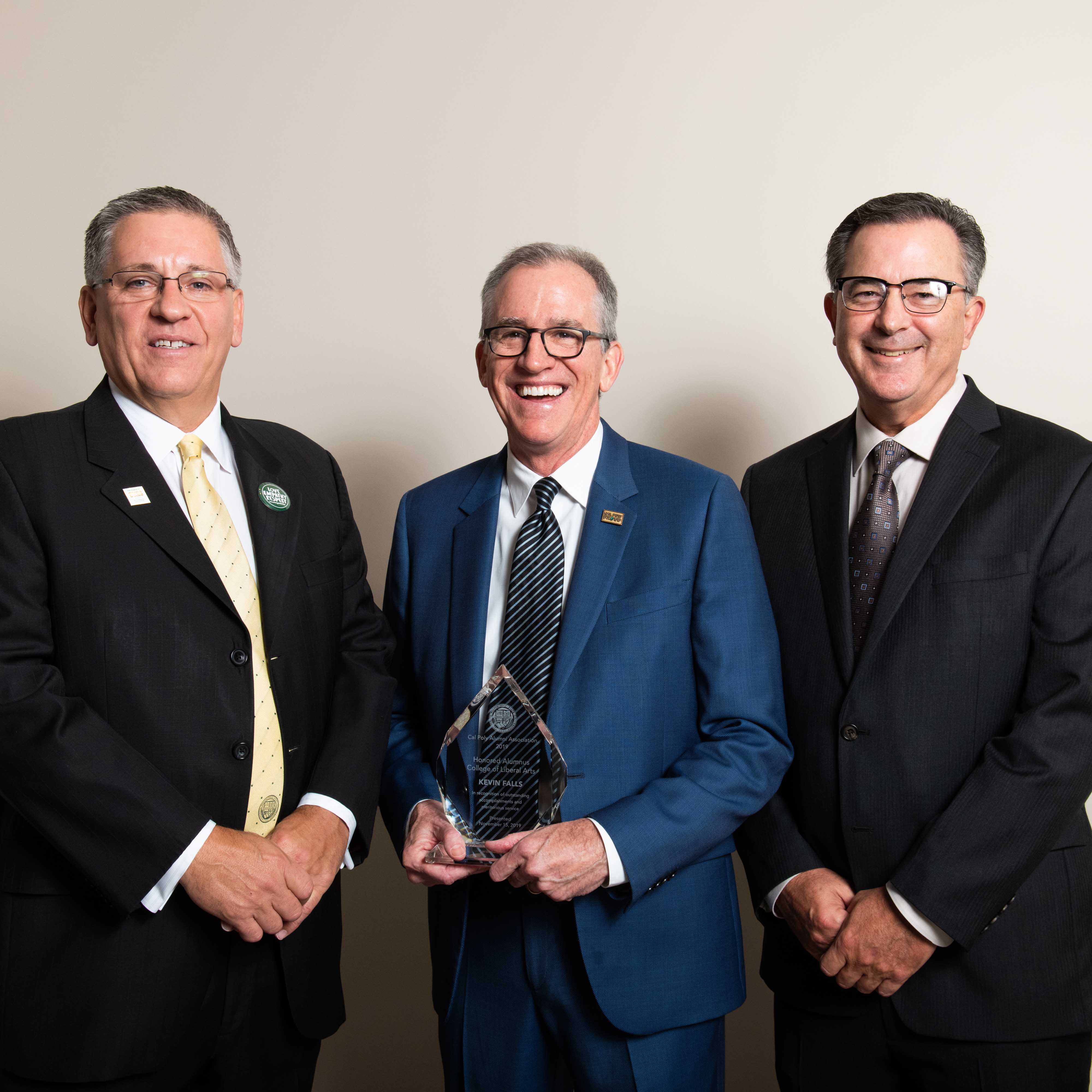 Honored alumnus Kevin Falls with President Armstrong and Dean Williams