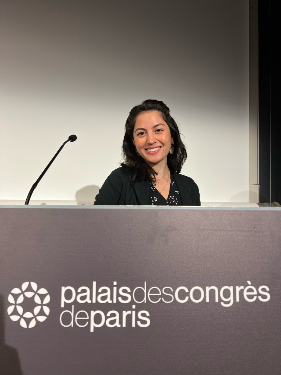 Matia Mathes smiling at the ICA Conference in Paris, France