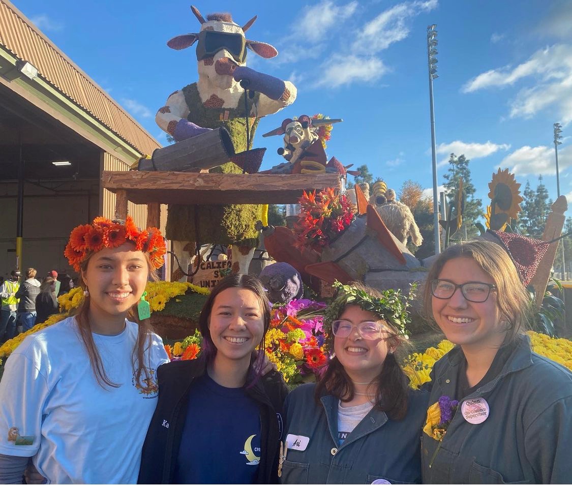 Avi McManus (third from left) poses for a photo in front of the award-winning float.