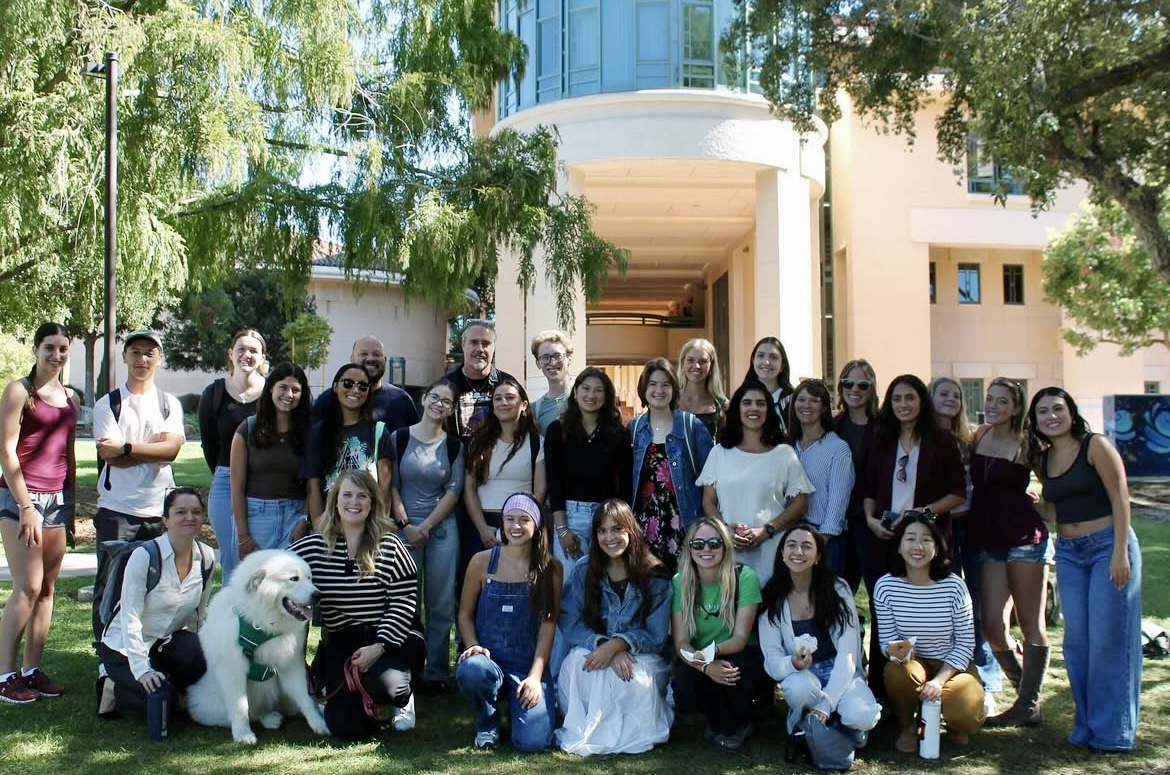 Students and professors smiling at Professors & Pastries October 2025 event