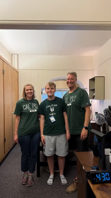 Dr. Mehl's family all wearing green Cal Poly shirts and smiling