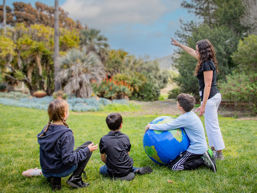 Children with Cal Poly student outdoor science education