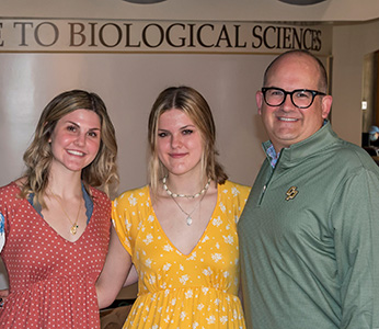 The Kostalnick family in the lobby of one of Cal Poly's Biological Sciences buildings.