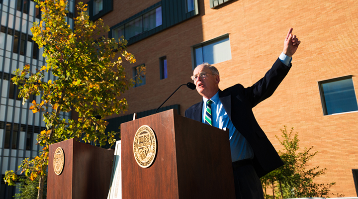 Dean Bailey pointing at the Baker Center