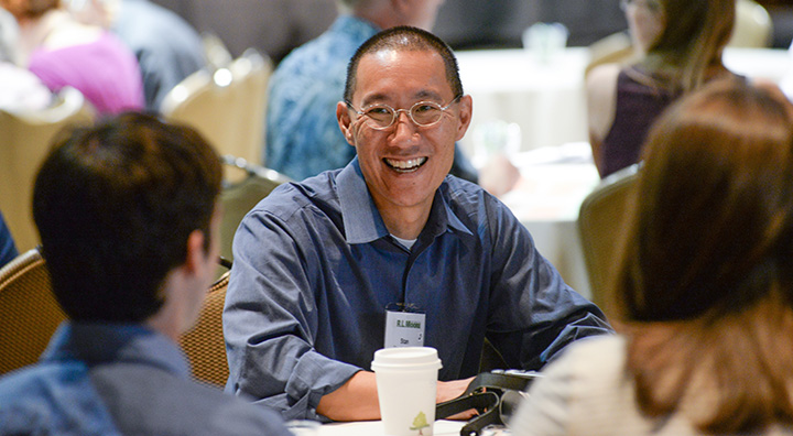 Image of Stan Yoshinobu interacting with students