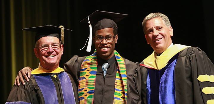 Dean Bailey and President Armstrong with a student at the annual Black Commencement