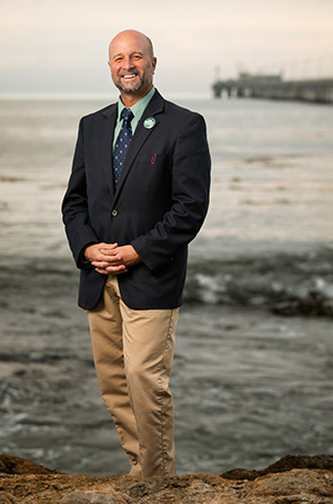 Dean Wendt in front of Cal Poly Pier and ocean