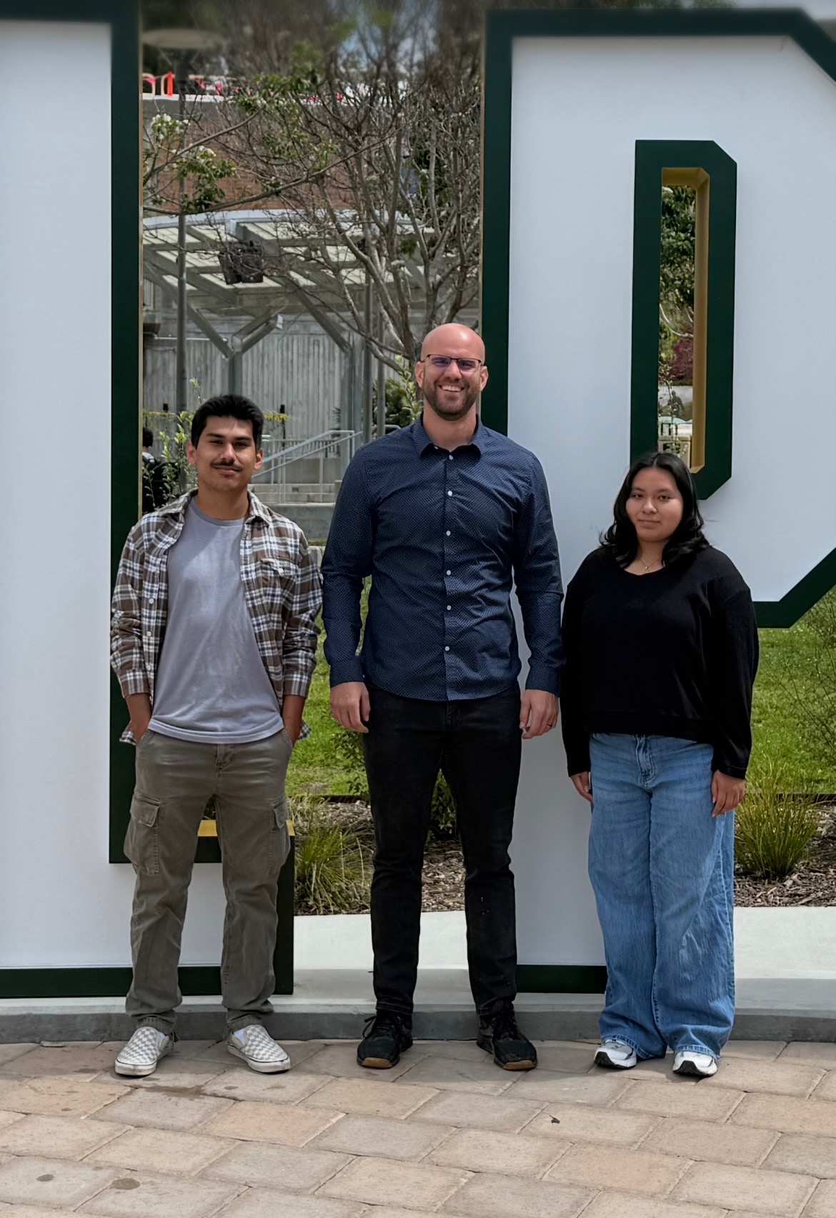 Antonio M. Bailon and Jazmin Garcia Lopez with Dr. Adam Seal.