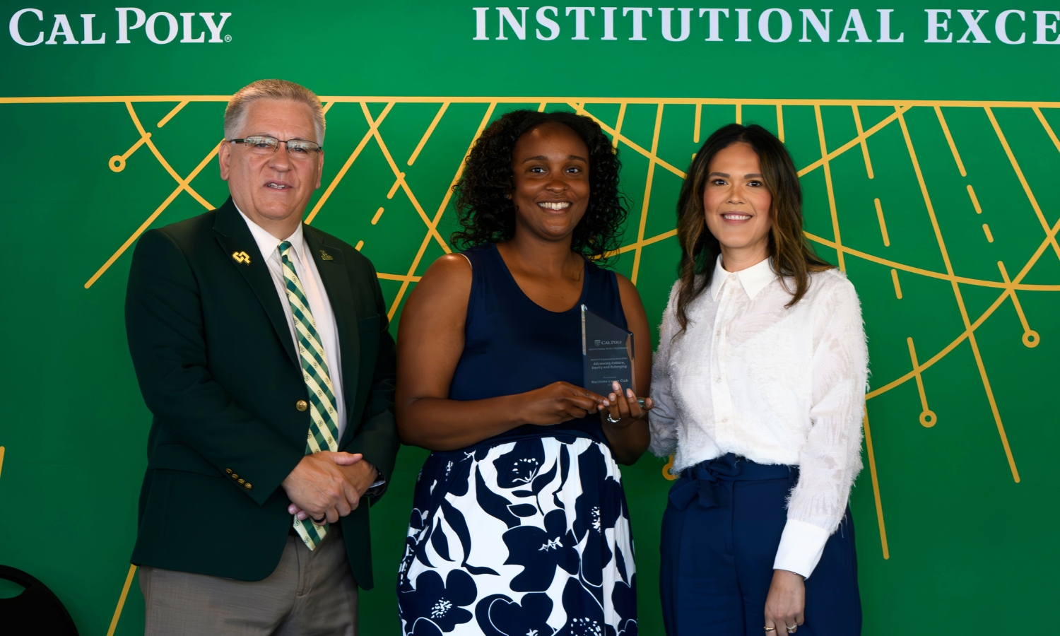 Meagan Nance, club advisor, with President Armstrong and Dr. Beya Makekau.