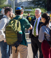 A group of four people talking