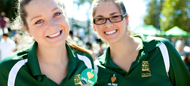 Two Poly Rep women broadly smiling into the camera