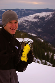 Picture of Ryan Swearingen holding RPTA water bottle on showshoeing trip to Yosemite