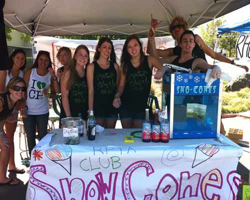 Club members pose at Open House booth