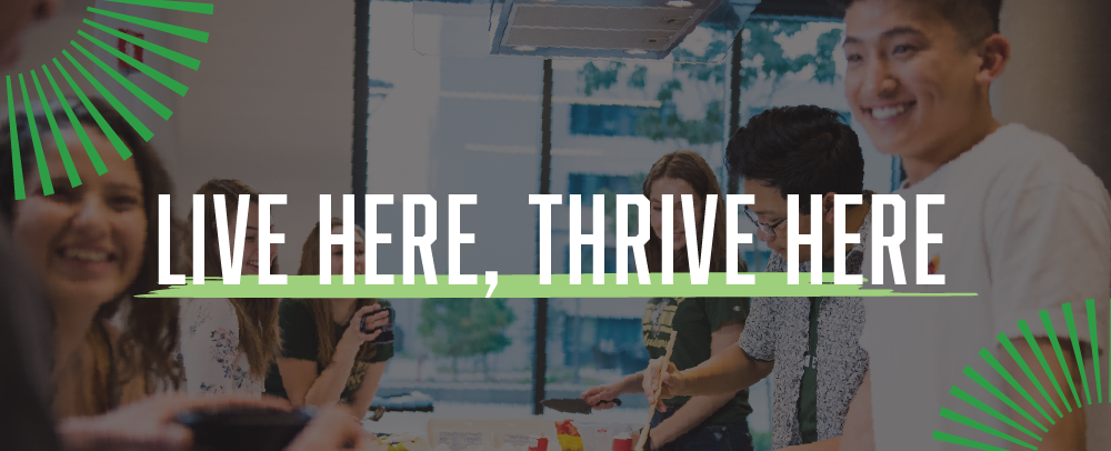 Students in the kitchen with text overlay that says Live here, thrive here.