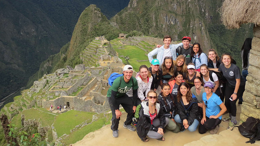 Cal Poly students above ruins
