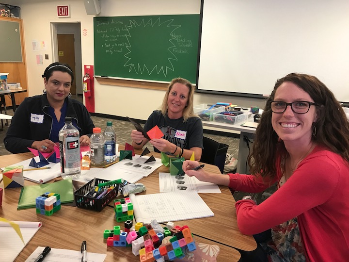  3 math teachers at a desk, working