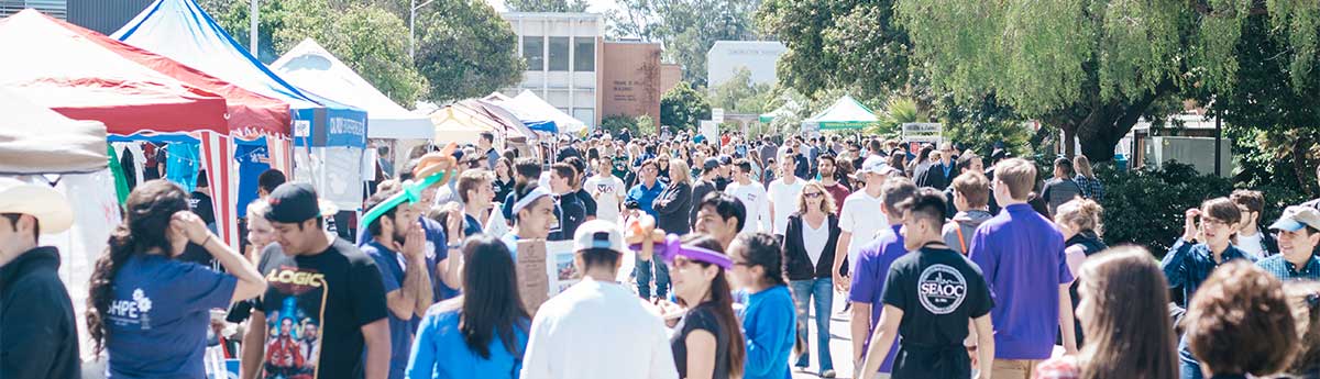 Open House attendees and booths at the Resource Fair