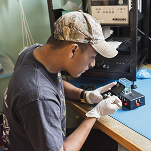 Student working on electronics in the lab