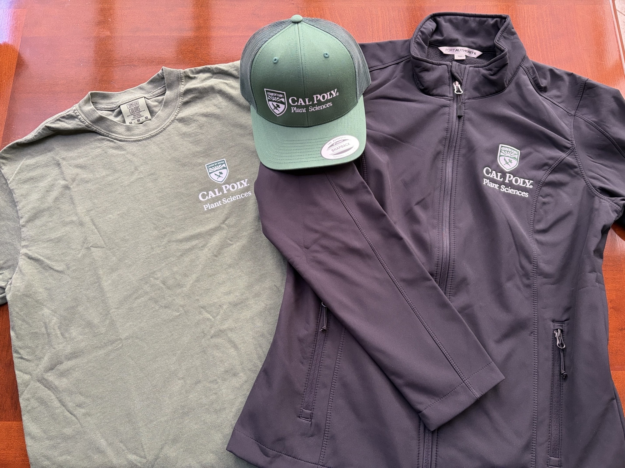 Cal Poly Plant Sciences hat, t-shirt, and jacket