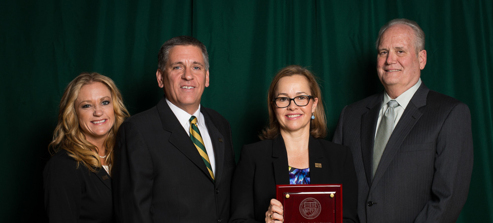 (Left to right) Kristie Boyett, Cal Poly Alumni Association President; President Jeffrey D. Armstrong; Kelli Seybolt; and Douglas Epperson, Dean of the College of Liberal Arts