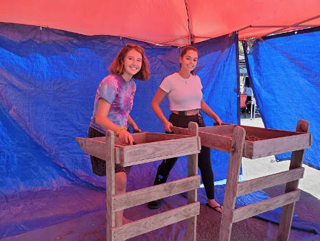 Social Sciences Club students demonstrating archaeological sifting at the Week of Welcome.