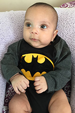 Baby in batman onesie