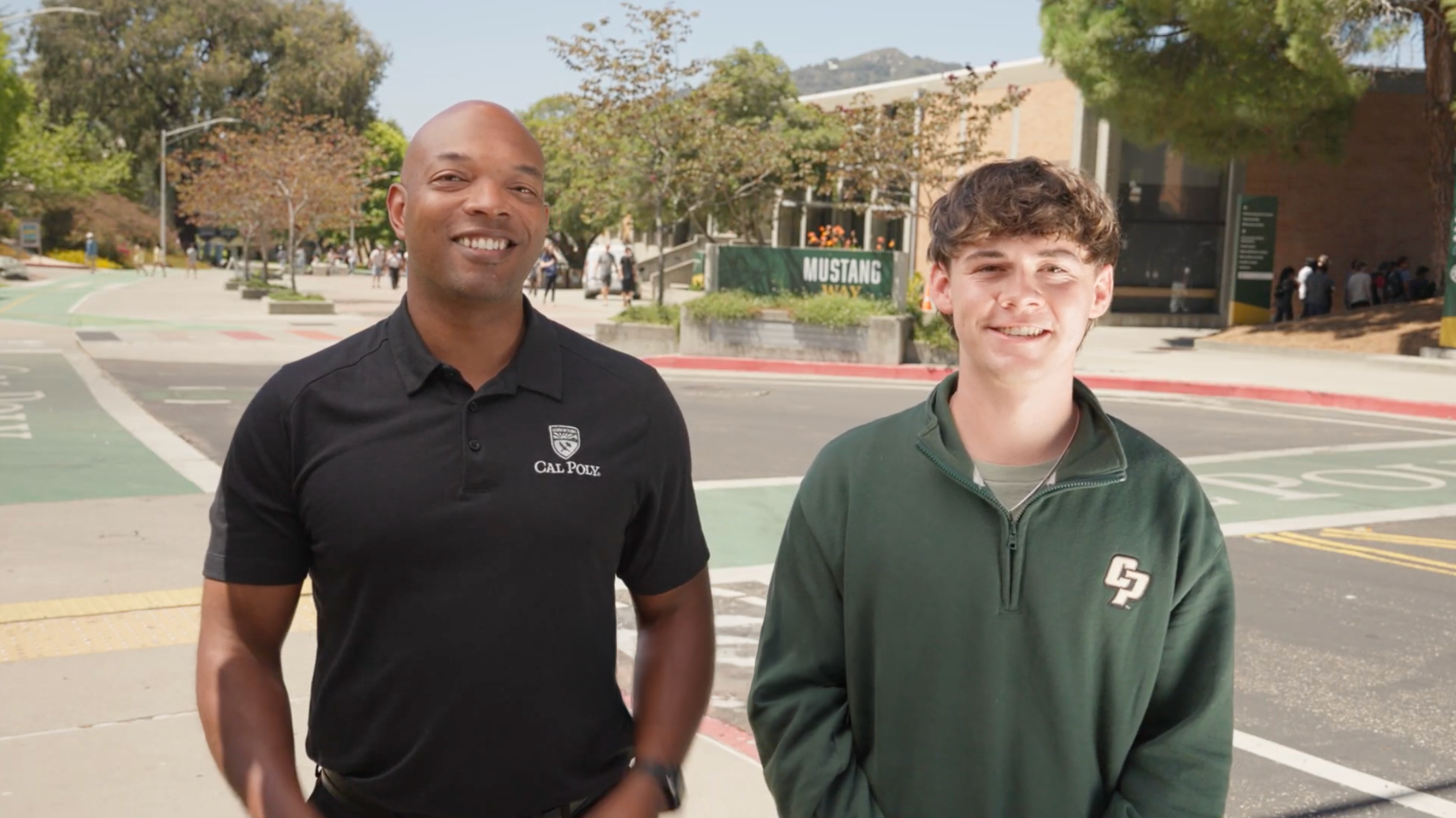 Vice President Terrance Harris and ASI President Tanner Schinderle with the Mustang Way sign in the background.