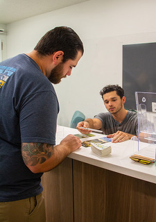 student being helped at desk