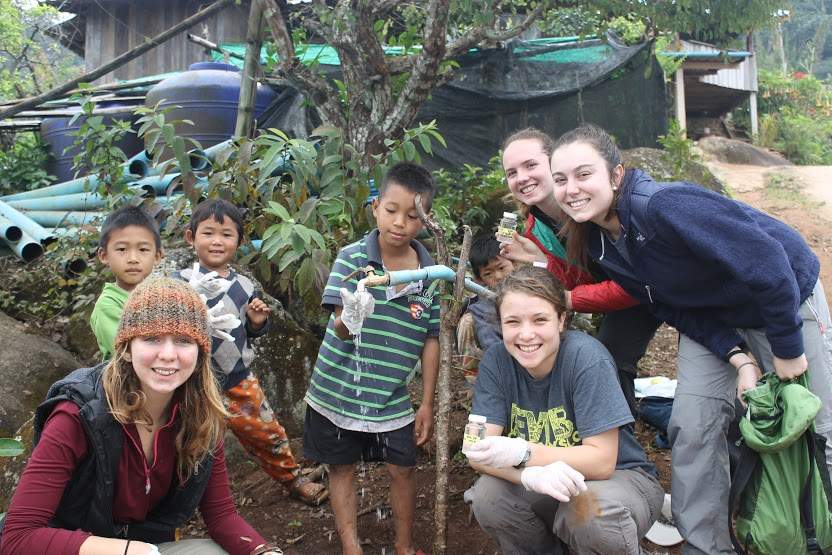 EWB students taking drinking water samples with children from the community of Maejantai. 